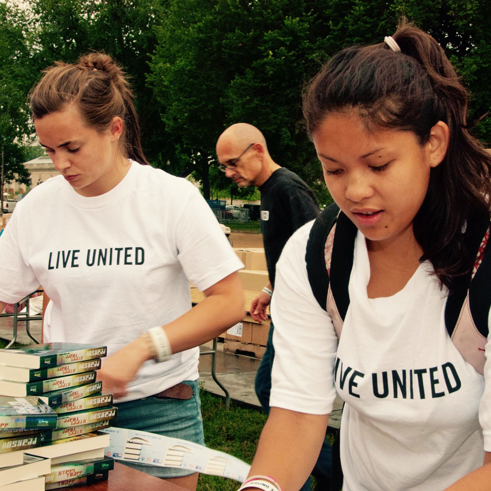 United Way volunteers helping with books